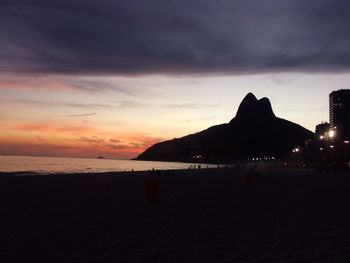 Scenic view of beach against sky during sunset