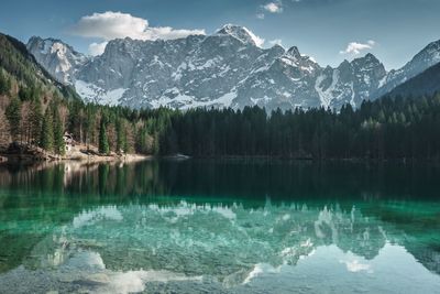 Scenic view of lake and mountains against sky