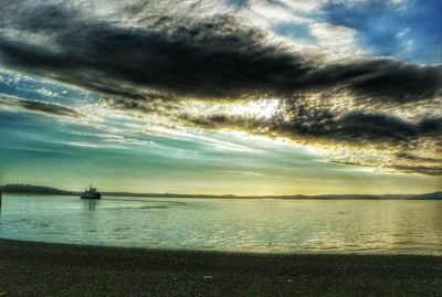 Scenic view of sea against cloudy sky