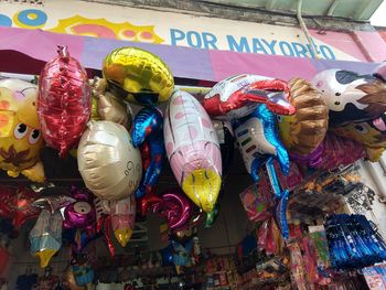 Multi colored toys for sale in market