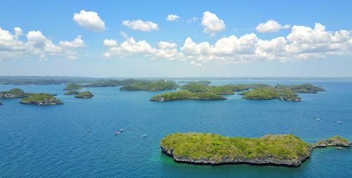 High angle view of sea against blue sky
