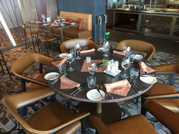 High angle view of chairs and table in restaurant