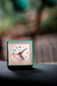 Close-up of clock on table