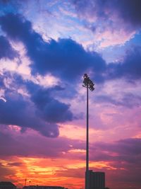 Low angle view of silhouette street against sky during sunset