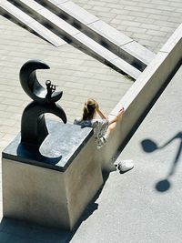 High angle view of people sitting on floor