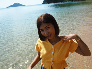 Portrait of a smiling young woman in sea