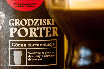 Close-up of wine glass with bottles