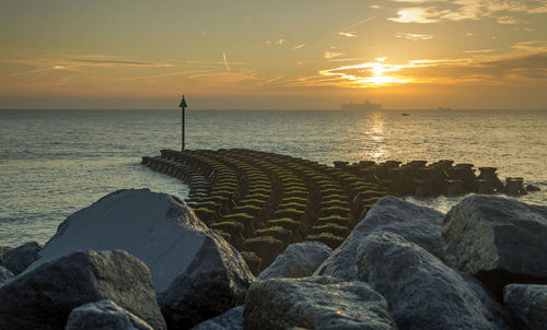 Scenic view of sea against sky during sunset