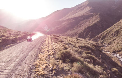 Road amidst mountains against sky