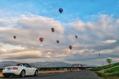 Scenic view of hot air balloons against sky