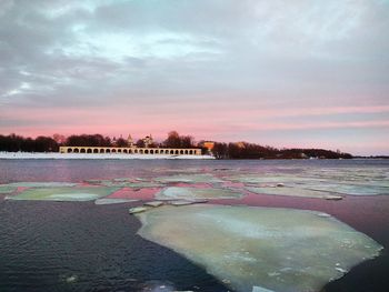 Scenic view of lake against sky during sunset