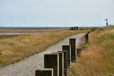 Coastal footpath with view over bay at low tide