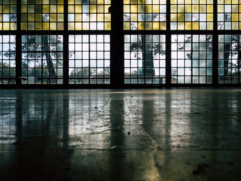 Low angle view of glass wall at old gym