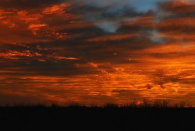 Scenic view of silhouette landscape against sky during sunset