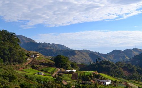 Scenic view of landscape and mountains against sky