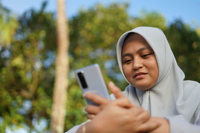 Young woman using mobile phone