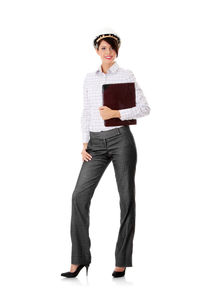 Portrait of smiling young woman standing against white background
