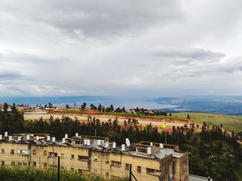 Lake kinneret through the green fields of the galilee mountains in israel