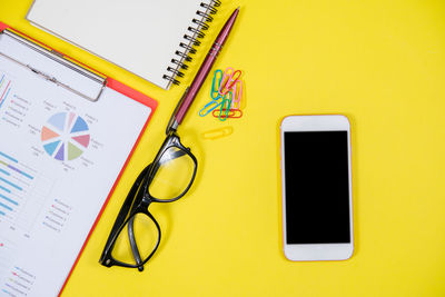 High angle view of smart phone on table