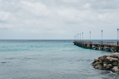 Pier over sea against sky