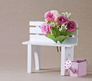 Pink rose flower vase on table