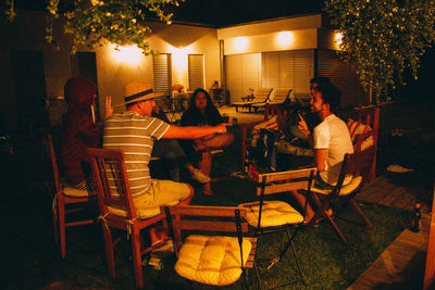 People sitting on chair at night