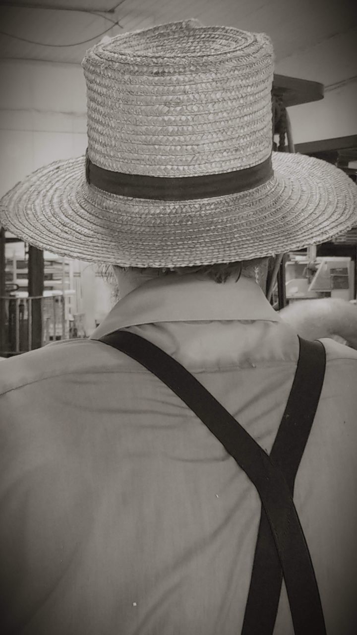 hat, clothing, indoors, close-up, focus on foreground, sun hat, straw hat, still life, no people, headwear, table, security, fashion, protection, glass - material, seat, built structure, textile, pattern, selective focus, personal accessory