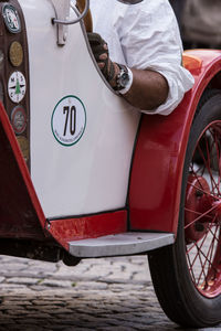 Reflection of man sitting in car