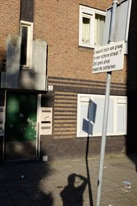 Man road sign in city