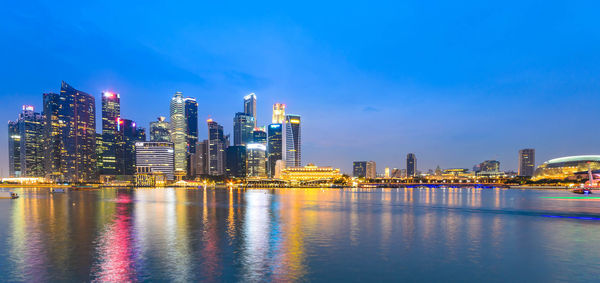 Illuminated city at waterfront