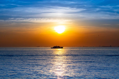 Sunset over the sea and a boat