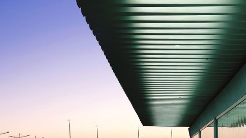 Low angle view of illuminated ceiling against clear sky