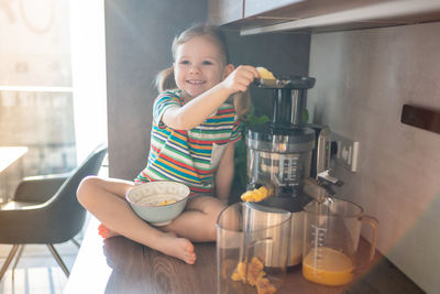 Portrait of cute boy preparing food at home