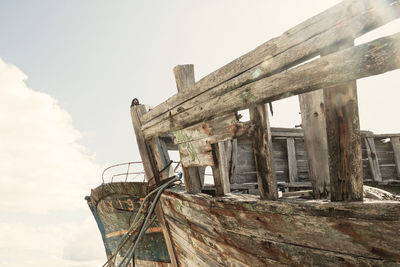 Low angle view of abandoned building against sky