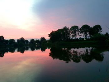 Scenic view of lake against sky during sunset