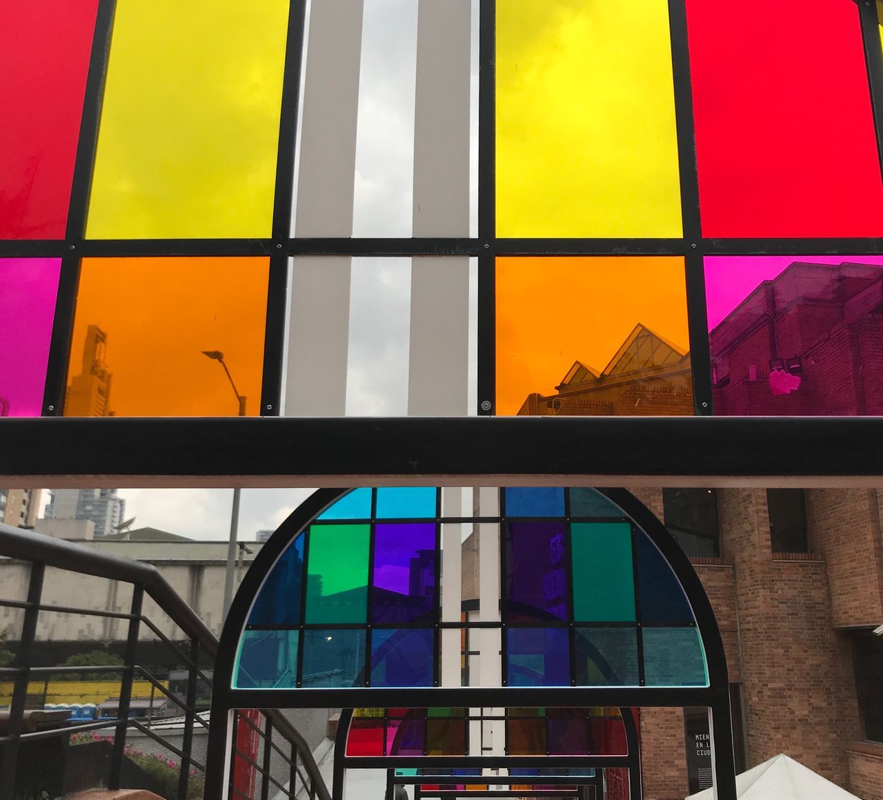 multi colored, architecture, glass - material, built structure, stained glass, transparent, no people, indoors, building, window, reflection, pattern, glass, wall - building feature, design, shape, day, yellow, purple