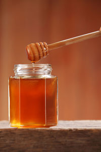 Close-up of honey in jar on table