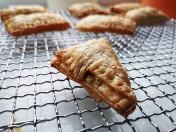 Close-up of bread on metal grate