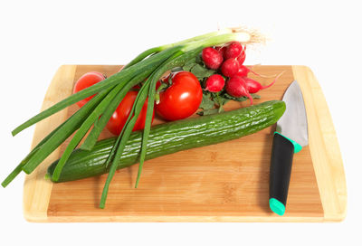 Close-up of fresh fruits and vegetables on cutting board