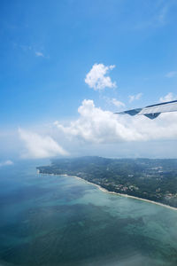 Scenic view of sea against blue sky