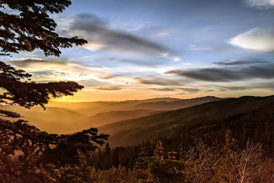 Scenic view of silhouette mountains against sky at sunset