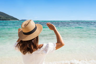 Rear view of woman looking at sea