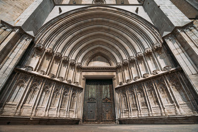 Low angle view of open door of historic building