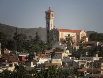 View of buildings in town against sky