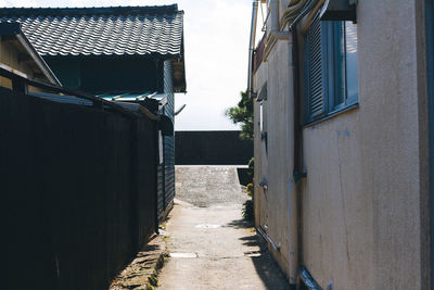 Walkway amidst buildings