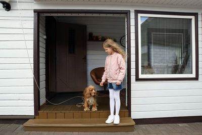 Full length of woman with dog