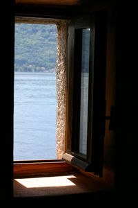 View of sea seen through window