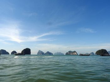 Scenic view of sea against blue sky