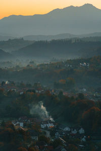 Village by mountain at sunrise