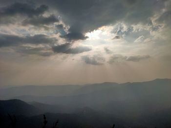 Scenic view of silhouette mountains against sky